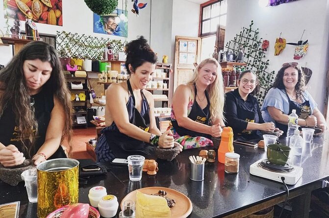 Discover Chocolate Making in Antigua Guatemala - Grinding beans for an old-style cacao drink