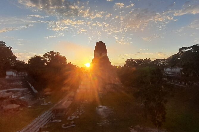From Flowers Sunrise in Tikal and Sunset in Yaxha in a day - The Great Plaza, Temple I, and Temple II