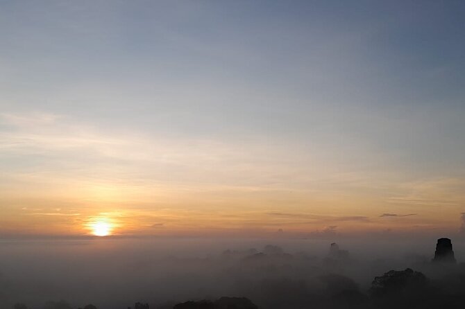 From Flowers Sunrise in Tikal and Sunset in Yaxha in a day - Temple V and the end of the Tikal visit