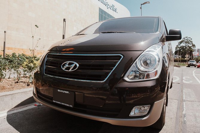 Private Transportation Service in Guatemala on a Minibus with A/C - Finding your driver at Guatemala City Airport