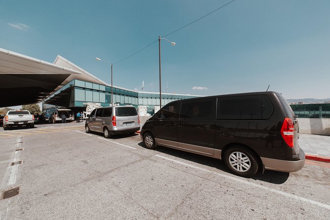 Private Transportation Service Within Guatemala City on a Minibus with A/C - What the Pink Gate Pickup Is Like